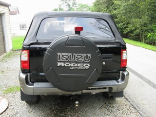 Illustration for article titled For $4,650, This 2002 Isuzu Rodeo Will Flip Its Lid, And That’s No Lie